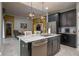 Modern kitchen with stainless steel appliances, granite counters, and dark cabinets at 3926 Bedford Ave, Winter Haven, FL 33884
