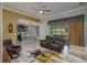 Open-concept living room featuring modern furnishings, neutral colors, and lots of natural light at 3926 Bedford Ave, Winter Haven, FL 33884