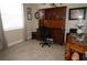 Office space with a built-in wooden desk, neutral paint, and large window for natural light at 3926 Bedford Ave, Winter Haven, FL 33884