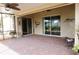 Spacious screened lanai patio featuring brick pavers, ceiling fans, and sliding glass doors for seamless indoor/outdoor living at 3926 Bedford Ave, Winter Haven, FL 33884