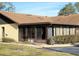 Condo exterior showcasing a sunroom and well-maintained landscaping at 40 Kimberly Ct, Winter Haven, FL 33880