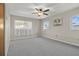 Spacious bedroom with gray carpeting and ample natural light at 412 Hillcrest Se Dr, Winter Haven, FL 33884