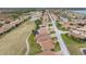 Aerial view of home community with lake and golf course at 4240 Dunmore Dr, Lake Wales, FL 33859