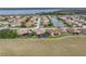 Aerial view of home community with lake and golf course at 4240 Dunmore Dr, Lake Wales, FL 33859