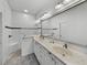 Bathroom with double vanity, large mirror, and shower at 4240 Dunmore Dr, Lake Wales, FL 33859