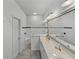 Bathroom with double vanity, large mirror, and shower at 4240 Dunmore Dr, Lake Wales, FL 33859