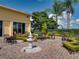 Relaxing courtyard with fountain, seating, and landscaping at 4240 Dunmore Dr, Lake Wales, FL 33859