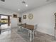 Bright dining area with wooden table and chairs, view to backyard pool at 4240 Dunmore Dr, Lake Wales, FL 33859