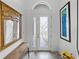 Bright and airy entryway with a stylish mirror and artwork at 4240 Dunmore Dr, Lake Wales, FL 33859