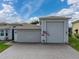 Exterior view of a house featuring a large garage and driveway at 4240 Dunmore Dr, Lake Wales, FL 33859
