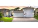 Attractive one-story home with a large garage and well-manicured lawn at 4240 Dunmore Dr, Lake Wales, FL 33859