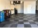 Garage with sink, storage and floor tiles at 4240 Dunmore Dr, Lake Wales, FL 33859