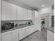 White kitchen cabinets and granite countertops at 4240 Dunmore Dr, Lake Wales, FL 33859