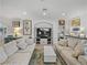 Spacious living room with comfortable sofas and a large TV at 4240 Dunmore Dr, Lake Wales, FL 33859