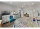 Main bedroom with king bed, dresser, and teal chair at 4240 Dunmore Dr, Lake Wales, FL 33859