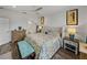 Main bedroom with king bed, teal decor, and ensuite bathroom access at 4240 Dunmore Dr, Lake Wales, FL 33859
