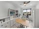 Home office with built-in shelving and a large desk at 4240 Dunmore Dr, Lake Wales, FL 33859