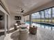 Covered patio with wicker furniture, fire pit, and pool view at 4240 Dunmore Dr, Lake Wales, FL 33859