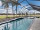 Screened pool with a view of the golf course at 4240 Dunmore Dr, Lake Wales, FL 33859