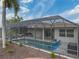 Screened-in pool and patio with outdoor kitchen at 4240 Dunmore Dr, Lake Wales, FL 33859