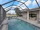 Relaxing pool and patio with outdoor kitchen and seating at 4240 Dunmore Dr, Lake Wales, FL 33859