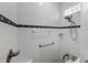 Walk-in shower with grab bars and tiled walls at 4240 Dunmore Dr, Lake Wales, FL 33859