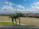 Panoramic view of golf course and lake from home at 4240 Dunmore Dr, Lake Wales, FL 33859