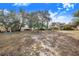 Large backyard with mature trees and plenty of space at 428 Durrell Ct, Winter Haven, FL 33884