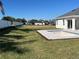 Backyard featuring a large pool under construction and a green lawn at 4593 Emerald Palms Dr, Winter Haven, FL 33884