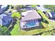 Aerial view of house with a screened pool and backyard at 514 Lake Mariam Ter, Winter Haven, FL 33884