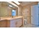 A bathroom with pink vanity, toilet and shower at 514 Lake Mariam Ter, Winter Haven, FL 33884