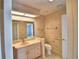 Bathroom with pink vanity, toilet, and shower/tub combo at 514 Lake Mariam Ter, Winter Haven, FL 33884