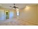 Bright bedroom with ceiling fan and en-suite bathroom at 514 Lake Mariam Ter, Winter Haven, FL 33884