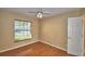 Charming bedroom featuring wood floors and a window at 514 Lake Mariam Ter, Winter Haven, FL 33884