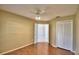 Well-lit bedroom with wood floors and access to another room at 514 Lake Mariam Ter, Winter Haven, FL 33884