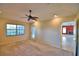 Spacious bedroom with ceiling fan and access to patio at 514 Lake Mariam Ter, Winter Haven, FL 33884