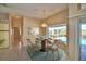 Dining room with a table set for four and pool view at 514 Lake Mariam Ter, Winter Haven, FL 33884