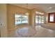 Dining area with pool view and decorative flooring at 514 Lake Mariam Ter, Winter Haven, FL 33884