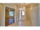 Bright and airy entryway with tile flooring and views to the living room at 514 Lake Mariam Ter, Winter Haven, FL 33884