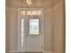 Entryway with white door and stained glass windows at 514 Lake Mariam Ter, Winter Haven, FL 33884