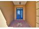 Front entry with blue door and decorative glass accents at 514 Lake Mariam Ter, Winter Haven, FL 33884