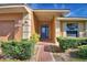 Welcoming front entry with blue door and brick walkway at 514 Lake Mariam Ter, Winter Haven, FL 33884