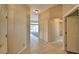 Hallway with tile flooring, closet, and bathroom access at 514 Lake Mariam Ter, Winter Haven, FL 33884