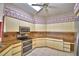 Kitchen with granite countertops and stainless steel appliances at 514 Lake Mariam Ter, Winter Haven, FL 33884