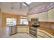 Kitchen with granite countertops and stainless steel appliances at 514 Lake Mariam Ter, Winter Haven, FL 33884