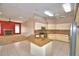 Kitchen with granite countertops and stainless steel appliances at 514 Lake Mariam Ter, Winter Haven, FL 33884