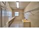 Bright laundry room with built-in shelving and sink at 514 Lake Mariam Ter, Winter Haven, FL 33884