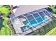 Enclosed pool and spa with screen enclosure at 514 Lake Mariam Ter, Winter Haven, FL 33884