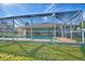Backyard view of house with screened pool at 514 Lake Mariam Ter, Winter Haven, FL 33884