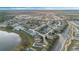 Community overview featuring a lake, roads, and numerous houses at 524 Lake Suzanne Dr, Lake Wales, FL 33859
